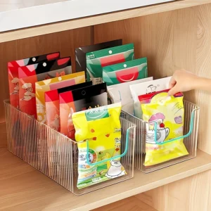 Clear kitchen organizer box with dividers for small pantry items